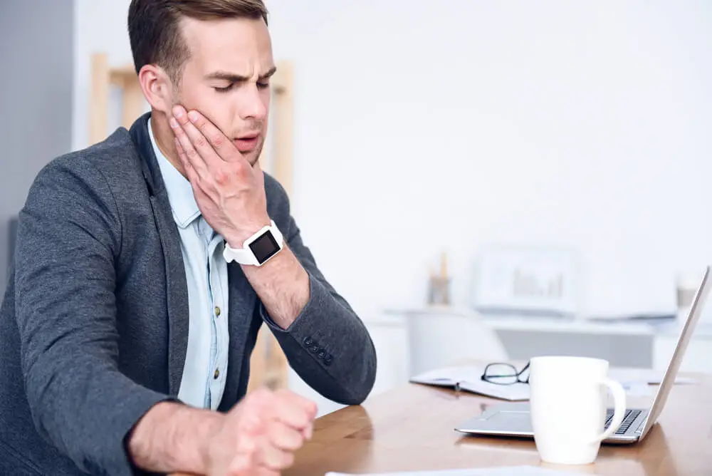 Causes and symptoms of temporomandibular joint dysfunction (TMJ disorder) shutterstock 438922891 tmj dysfunction