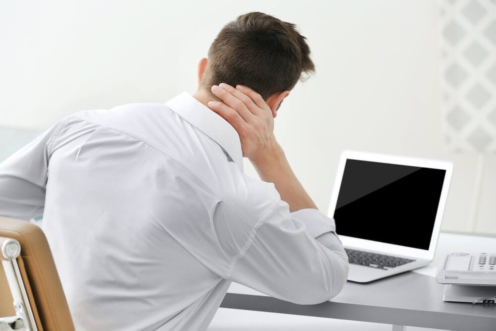 Two causes of neck pain at the base of the skull Jenison, MI shutterstock 562205701 neck pain at base of skull